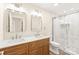 Beautiful bathroom with a double sink vanity, marble shower, and modern fixtures at 6430 Matlea Ct, Charlotte, NC 28215