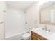 Well-lit bathroom featuring a vanity and bathtub with modern fixtures at 6430 Matlea Ct, Charlotte, NC 28215