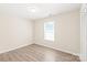 Bedroom with hardwood floors, ample natural light, and built in closet at 6430 Matlea Ct, Charlotte, NC 28215