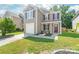 Charming two-story home with a well-manicured lawn and colorful flowerbed near the front door at 6430 Matlea Ct, Charlotte, NC 28215