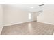 Spacious living room with modern flooring, neutral walls, and ample natural light from a nearby window at 6430 Matlea Ct, Charlotte, NC 28215