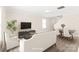 Staged living room showcasing neutral furniture, wood-look floors, and natural light from the windows at 6430 Matlea Ct, Charlotte, NC 28215