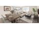 Open floor plan integrating the dining area and living room seamlessly, with a view into the modern kitchen at 6430 Matlea Ct, Charlotte, NC 28215