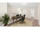 Bright office space with hardwood floors, neutral walls, desk, and stylish decor at 6430 Matlea Ct, Charlotte, NC 28215