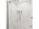 Upgraded shower with marble tiling, glass doors, and a pebble floor design at 6430 Matlea Ct, Charlotte, NC 28215