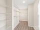 Spacious walk-in closet with custom shelving, ample storage, and natural light at 6430 Matlea Ct, Charlotte, NC 28215