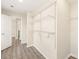 Well-organized walk-in closet featuring shelving units, and access to hallway at 6430 Matlea Ct, Charlotte, NC 28215