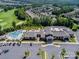 Aerial view of community clubhouse featuring a large pool, surrounding trees, and ample parking at 7057 Shenandoah Dr, Fort Mill, SC 29707