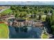 Aerial of community entrance with waterfall, stone landscaping and views of nearby roadways and trees at 7057 Shenandoah Dr, Fort Mill, SC 29707