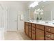 Bathroom featuring a double vanity with framed mirror, providing lots of storage at 7057 Shenandoah Dr, Fort Mill, SC 29707