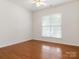 Clean, empty bedroom with hardwood flooring and natural light at 7057 Shenandoah Dr, Fort Mill, SC 29707