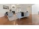 Cozy living room with hardwood floors, fireplace, and comfortable seating arrangement at 7057 Shenandoah Dr, Fort Mill, SC 29707