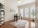 Home office with hardwood floors, bright windows, a modern desk, and neutral decor at 7057 Shenandoah Dr, Fort Mill, SC 29707