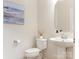Elegant powder room with pedestal sink and stylish decor at 7057 Shenandoah Dr, Fort Mill, SC 29707