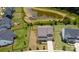 Aerial view of a home with a fenced backyard, next to a pond and community amenities at 7058 Cloer Ct, Charlotte, NC 28214