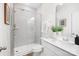 Modern bathroom featuring a glass-enclosed shower, stylish vanity, and neutral color palette at 7058 Cloer Ct, Charlotte, NC 28214