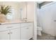 Modern bathroom with white vanity, quartz countertop, and walk-in shower at 7058 Cloer Ct, Charlotte, NC 28214