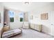 Cozy bedroom featuring a neutral color scheme, carpet, and ample natural light at 7058 Cloer Ct, Charlotte, NC 28214