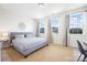 Bedroom with three windows and light-colored carpet at 7058 Cloer Ct, Charlotte, NC 28214