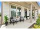 Inviting front porch with seating area, perfect for relaxing and enjoying the outdoors at 7058 Cloer Ct, Charlotte, NC 28214