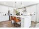 Modern kitchen featuring white cabinetry, stainless steel appliances, and a spacious center island at 7058 Cloer Ct, Charlotte, NC 28214