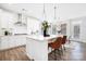 Modern kitchen featuring white cabinetry, stainless steel appliances, and a spacious center island at 7058 Cloer Ct, Charlotte, NC 28214