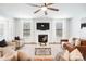 Cozy living room with fireplace, plush seating, and elegant decor at 7058 Cloer Ct, Charlotte, NC 28214