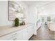The pantry features ample storage space with white cabinets, quartz countertop, and convenient access to kitchen at 7058 Cloer Ct, Charlotte, NC 28214