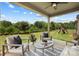 Covered patio overlooking a spacious backyard, ideal for outdoor entertainment at 7058 Cloer Ct, Charlotte, NC 28214