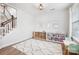 Spacious playroom with plenty of storage, a cozy rug, and natural light for ' enjoyment at 7058 Cloer Ct, Charlotte, NC 28214