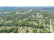 An aerial view of a neighborhood with tree-lined streets and well-maintained homes at 7224 Newell Acres Dr, Charlotte, NC 28215