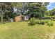 The property has a spacious backyard with a shed and a thriving garden at 7224 Newell Acres Dr, Charlotte, NC 28215