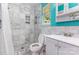 This bathroom features marble tile, a window, a shower, and a toilet at 7224 Newell Acres Dr, Charlotte, NC 28215