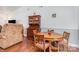 Cozy dining area featuring hardwood floors, table with four chairs and classic wood hutch at 7224 Newell Acres Dr, Charlotte, NC 28215