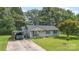 Charming single-story home with well-maintained lawn, carport and patriotic curb appeal at 7224 Newell Acres Dr, Charlotte, NC 28215