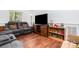 Inviting living room featuring vaulted ceiling, laminate flooring, and comfortable seating at 7224 Newell Acres Dr, Charlotte, NC 28215