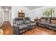 Inviting living room with laminate flooring, white trim, and comfortable reclining seating at 7224 Newell Acres Dr, Charlotte, NC 28215