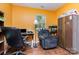 Functional home office with hardwood floors, seating, and ample storage at 7224 Newell Acres Dr, Charlotte, NC 28215