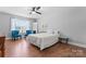Cozy bedroom featuring hardwood floors, natural light, and soothing decor at 7355 Drury Ln, Denver, NC 28037