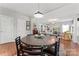 Inviting dining space featuring a round table, black chairs, and an open layout that seamlessly connects to the living areas at 7355 Drury Ln, Denver, NC 28037