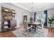 Elegant dining area featuring a modern chandelier, stylish furnishings, and an open layout, perfect for entertaining at 7355 Drury Ln, Denver, NC 28037