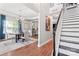 Elegant dining room featuring a chandelier, wood table and flooring, and modern decor at 7355 Drury Ln, Denver, NC 28037