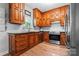 Well-appointed kitchen with warm wood cabinets, stainless steel appliances, and ample counter space for cooking and meal prep at 7355 Drury Ln, Denver, NC 28037
