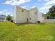 Expansive backyard featuring a lush green lawn and ample space for outdoor enjoyment at 8516 Paw Valley Ln, Charlotte, NC 28214