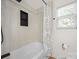 Bathroom featuring a tub, a shower with tiled walls, and updated fixtures at 8516 Paw Valley Ln, Charlotte, NC 28214