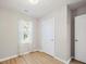 Bedroom featuring wood-look floors, neutral walls, and doors for easy access at 8516 Paw Valley Ln, Charlotte, NC 28214