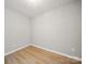 Bedroom featuring wood-look floors and neutral walls at 8516 Paw Valley Ln, Charlotte, NC 28214