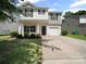 Charming two-story home with a welcoming front porch and attached one car garage at 8516 Paw Valley Ln, Charlotte, NC 28214