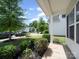 Exterior view of home featuring a well-manicured front yard with various plants and trees for added curb appeal at 8516 Paw Valley Ln, Charlotte, NC 28214