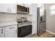Updated kitchen features stainless steel appliances and white cabinets at 8516 Paw Valley Ln, Charlotte, NC 28214